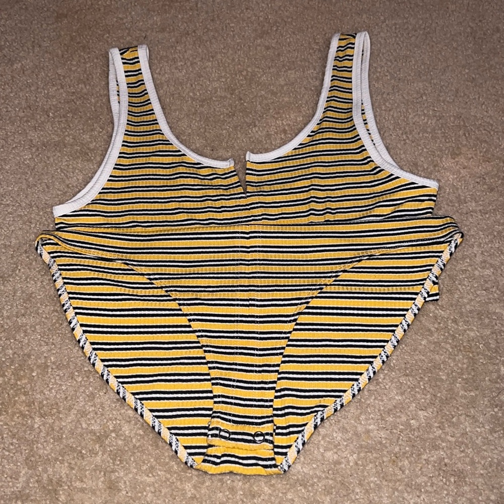 Stripped yellow black and white tank suit
